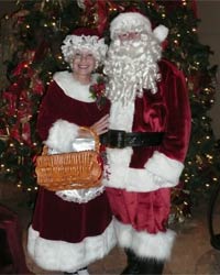 velvet mrs santa claus suit with santa standing